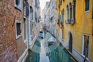 View of Canal with boats in Venice, Italy. Venice is a popular tourist destination of Europe photo
