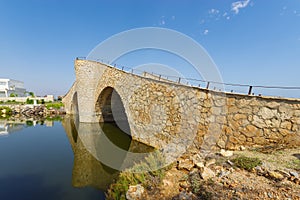 View on the canal in Mar Menor and an interesting arched bridge photo
