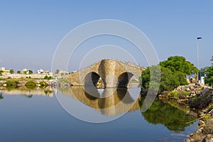 View on the canal in Mar Menor and an interesting arched bridge photo
