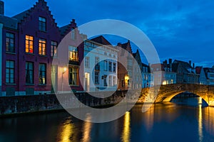 View of canal and oldbuildings in Bruges, Belgium at dusk