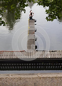 View of the canal, pier and platform with lifebuoy in the city of Vlaardingen