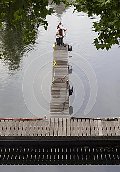 View of the canal, pier and platform with lifebuoy in the city of Vlaardingen