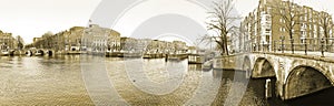 View of the canals with bridge in Amsterdam