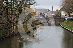 View of canals and streets of Gent town, Belgium in rainy day