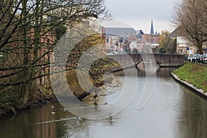 View of canals and streets of Gent town, Belgium in rainy day