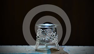 View of candle stand pot or glass with flower design.