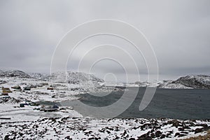 View of Cape Dorset Nunavut with a view of the mountains and ocean, a northern Inuit community
