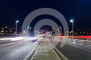 View of car streak lights at night in Autonomia bridge in Badajoz city photo