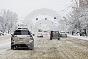 View from the car window during rain and wet snow. Poor visibility while driving around the city.