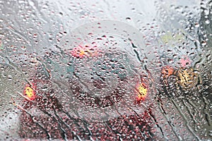 View from the car windscreen during rain and wet snow. Poor visibility while driving around the city.