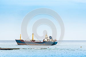 View of a cargo ship in the ocean, Bayahibe, La Altagracia, Dominican Republic. Copy space for text.