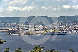 View of cargo ships docked at Pier VII of the Port of Trieste loading:unloading containers