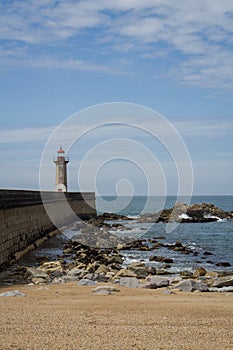 View from Carneiro beach in Porto to pier and lighthouse Felgueiras photo