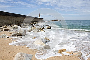 View from Carneiro beach in Porto to pier and lighthouse Felgueiras photo