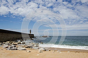 View from Carneiro beach in Porto to pier and lighthouse Felgueiras photo