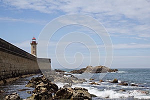 View from Carneiro beach in Porto to pier and lighthouse Felgueiras photo