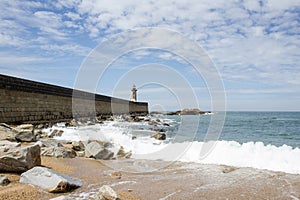 View from Carneiro beach in Porto to pier and lighthouse Felgueiras photo