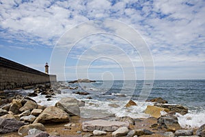 View from Carneiro beach in Porto to pier and lighthouse Felgueiras photo