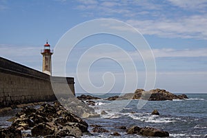 View from Carneiro beach in Porto to pier and lighthouse Felgueiras photo