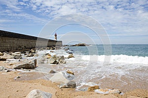 View from Carneiro beach in Porto to pier and lighthouse Felgueiras photo