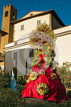 View of Castiglion Fibocchi medieval village with carnival mask