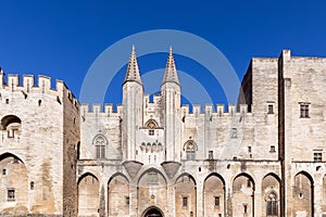 View of the castle facade of Palace of the Popes in the city of Avignon