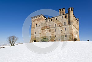 View of the Castle of Grinzane Cavour in winter with snow