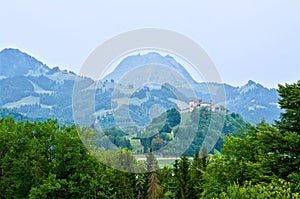 A view of a castle and mountains