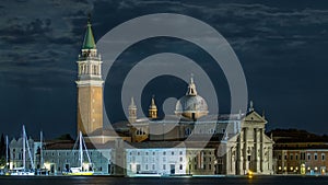 A view of the Cathedral of San Giorgio Maggiore from San Marco square at night timelapse, Venice, Italy