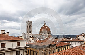 View of the Cathedral of Santa Maria - Del - Fiore and the Giotto`s bell tower from the rooftops in Florence, Italy