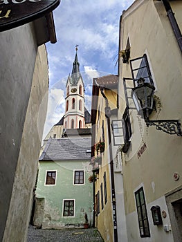 View of the Cathedral of St. Vitus through a medieval street in Cesky Krumlov