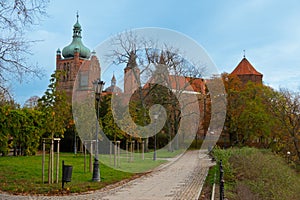 View Cathedral towers and princely castle, of the Tumskie hill in autumn. Plock, Poland