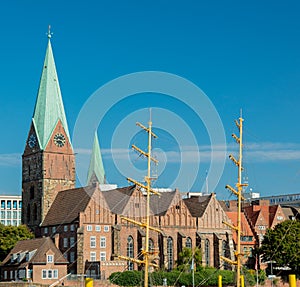 View at Catholic church and boat mast