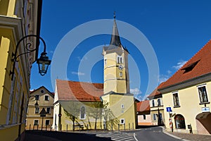 View of catholic church with a yellow facade at Kostanjevica na Krki in Dolenjska