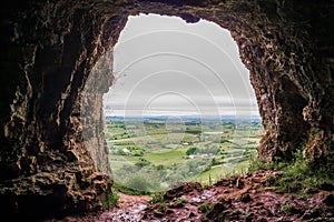 View from a cave on a beautiful scenery. Cloudy sky. Natural frame concept