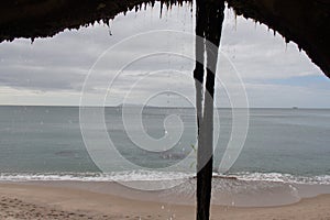 The view from a cave on a horizon line over sea, Homunga Bay, New Zealand