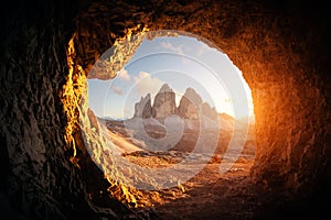 View from the cave in mountain against Three peaks of Lavaredo photo