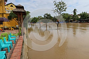 View of a central flooded street in Hoi An, Vietnam along the Thu Bon River during the 2021 rainy season