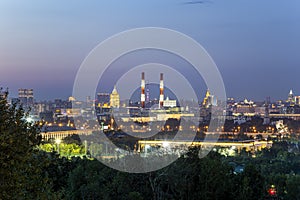 View of central Moscow from Sparrow Hills or Vorobyovy Gory observation viewing platform at sunset. Russia