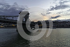 View of the Chain Bridge at dusk from the Pest riverbank, Budapest, Hungary photo