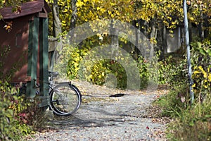 View of chained bicycle at entrance of trail in Orleans, Ontario-Petrie island