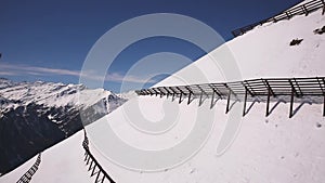 View from the chairlift in the Alps in the ski area in Austria during winter.