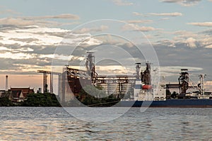 View of Chao Phraya River that sees Oil and gas refinery industrial factory with Cargo ship
