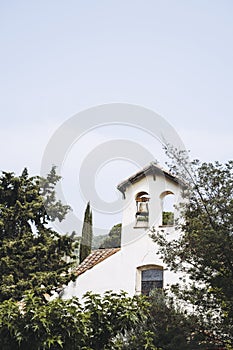 View of the chapel and bell tower of the village of Palalda in Amélie-les-Bains, France