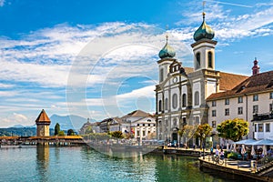 View at the Chapel bridge over Reuss river and Jesuit church in Luzern - Switzerland