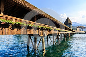 View at the Chapel bridge over Reuss river in Luzern Lucerne.