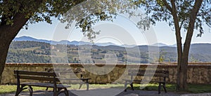 View of the characteristic Italian countryside. Rural scene in relaxation. Belvedere with benches