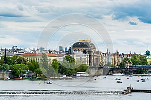 View from Charles Bridge, The  clorful buildings along the bank of Vltava river with National Theatre in Prague city,  the Vltava