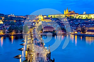 View of Charles Bridge, Prague Castle and Vltava river in Prague, Czech Republic during blue hour photo