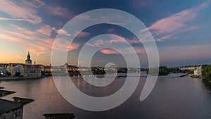 View from Charles Bridge in Prague before the sunrise night to day timelapse, Bohemia, Czech Republic.